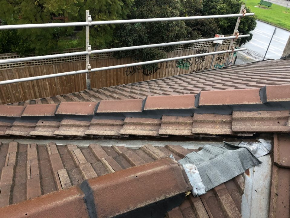 damaged ridge capping on a tile roof causing chimney roof leaks